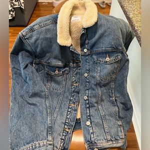 Jean jacket, with fuzzy inside! Super warm and comfy.
